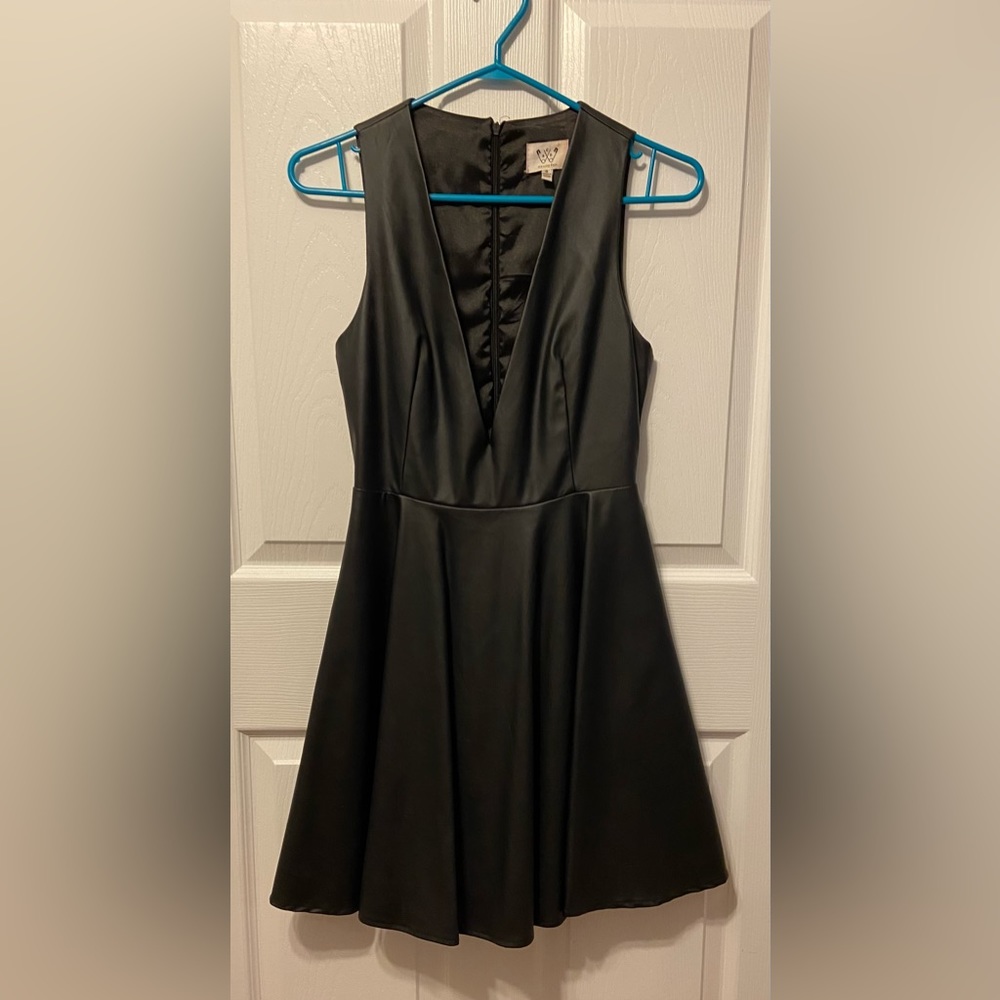 Faux leather dress with deep v neckline by six crisp days